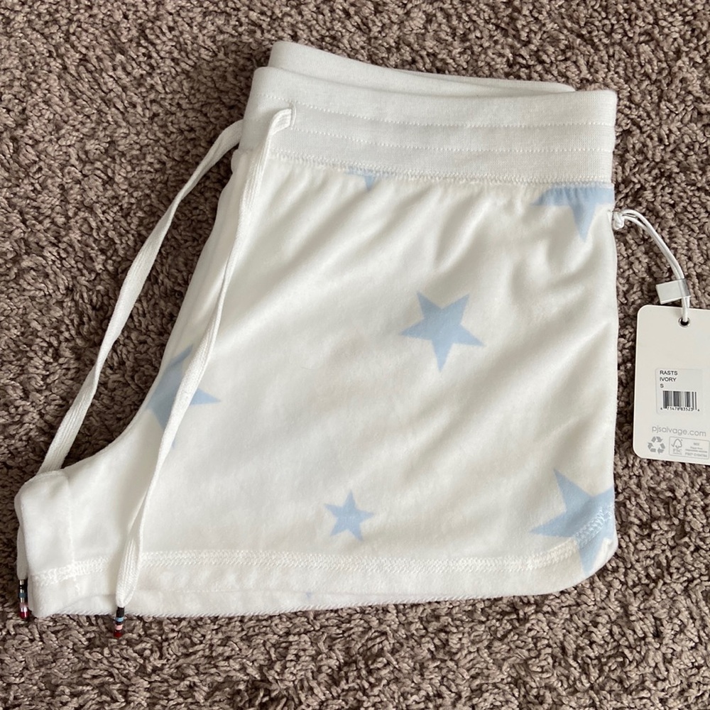 PJ Salvage rasts ivory shorts.